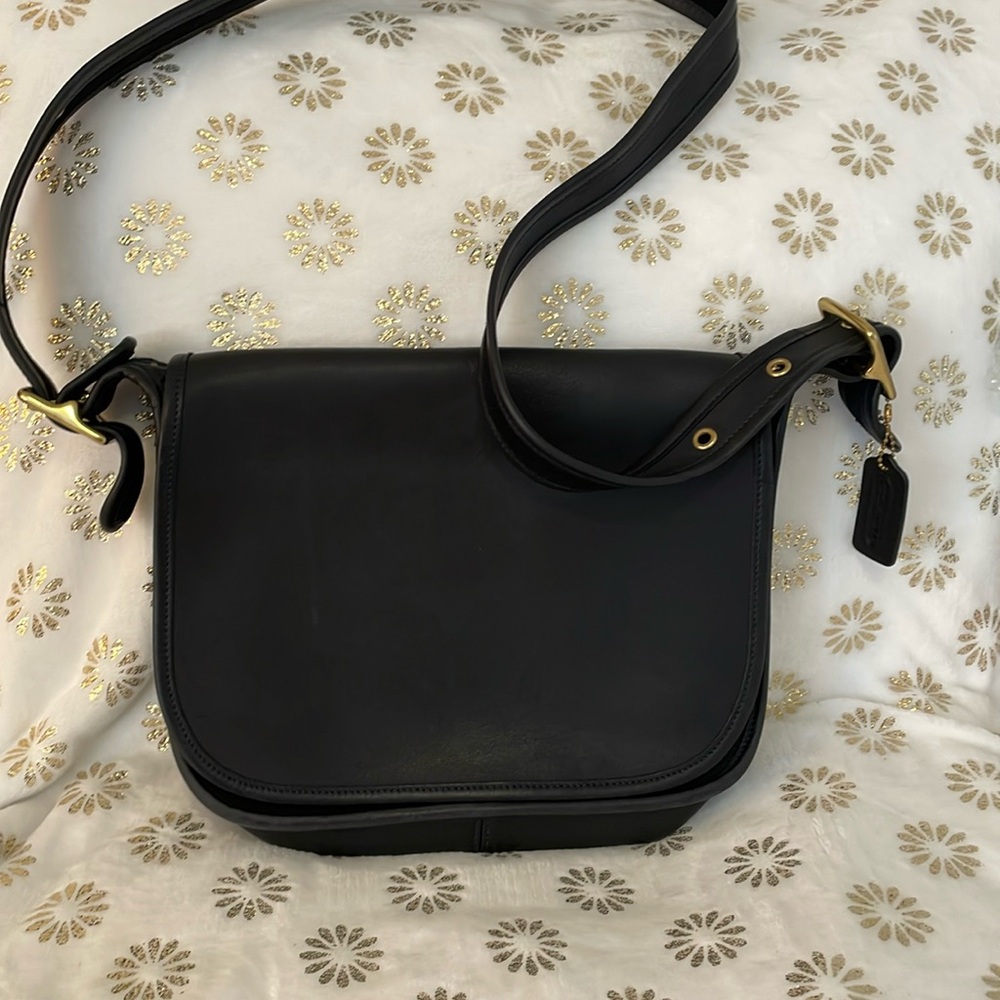 Black Coach Patricia legacy. flap bag with leather like butter. 12longx10high.
